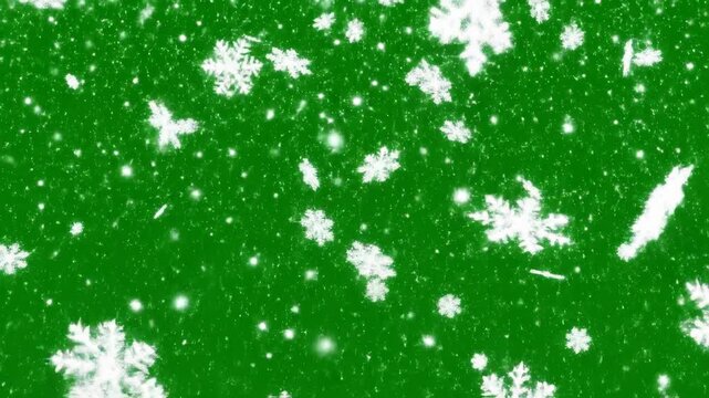 Animated white snowflakes on emerald green backdrop for holiday season