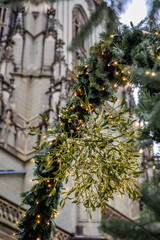 Mistletoe on a fir garland at Christmas Market by the Bern Minster, Switzerland