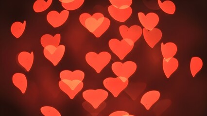 Glowing red heart bokeh abstract romantic dreamy cinematic background.