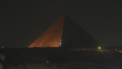 Cairo,Egypt - December 2, 2025:  Illumiated Khufu Pyramid and Khafre's Pyramid in Egypt