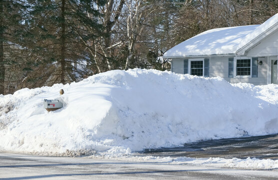snow pile in winter at driveway after snow storm