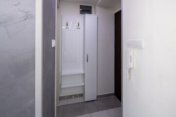 interior of an apartment entrance hallway with a shelf