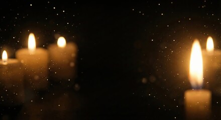 Atmospheric Candle Flames Illuminate a Dark, Serene Background with Sparkling Light