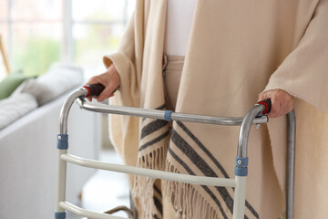 Senior woman with walker at home, closeup