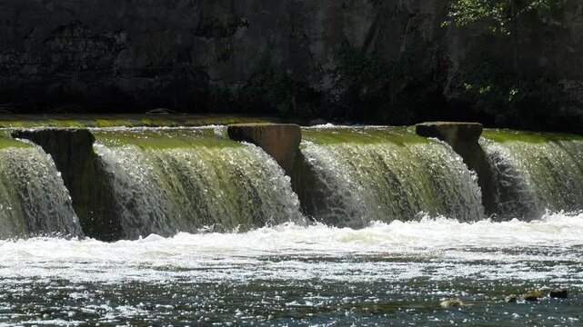 Flow of water through the spillway of a dam, slow motion
