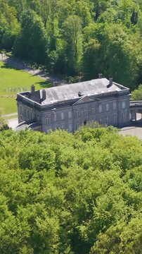 complete compound ch&acirc;teau seneffe scene green cover trees serene pond enhancing natural estate to revealing left right pans aerial of de belgium 