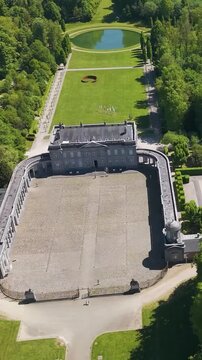 ch&acirc;teau seneffe complete building surrounding structures fountains several water bodies below enhances estate's around circles aerial drone view of de 