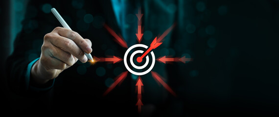 businessman highlighting a central target icon with arrows pointing inward, symbolizing business focus, strategic direction, goal-setting, precision, and effective decision-making for success