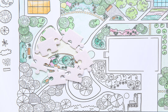 Puzzle pieces on zoning plan, closeup