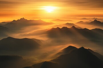 Obraz premium A breathtaking view of a mountain range under a vibrant sunrise, with the sun casting a warm glow on the peaks and valleys.