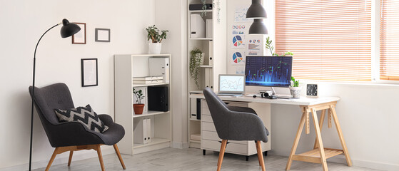 Interior of light data scientist's office with workplace