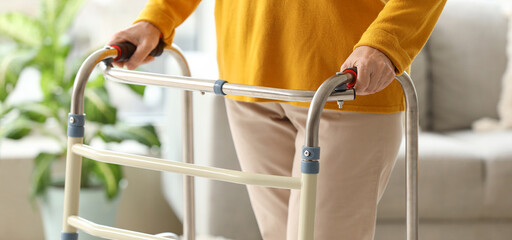 Senior woman with walker at home