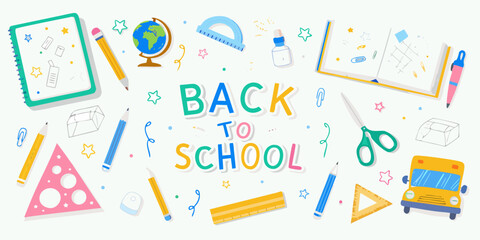 Colorful back to school supplies arranged in a playful and creative composition