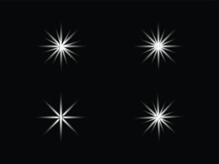 PrintFour bright white starbursts against a solid black background creating a sparkling effect