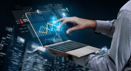 A business professional engages with data trends on a laptop, highlighting analysis through graphs and charts in a futuristic cityscape setting at night. Scalp