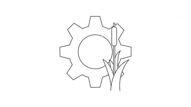 A gear encompasses a circular space with a cattail and some blades of grass in front of the gear