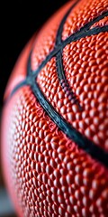 Close-up of a basketball's surface texture, highlighting grip dimples and stitching details,  design,  grip
