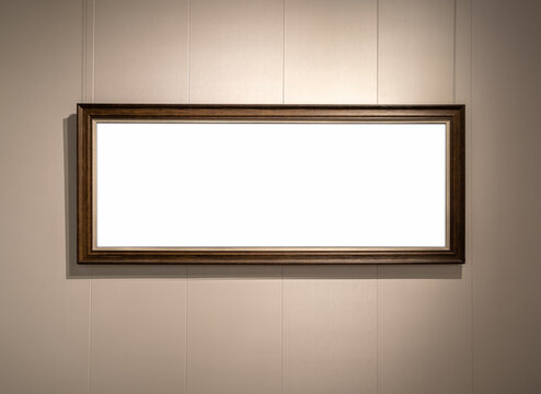 Mockup blank luxury dark brown wooden panoramic frame on gallery wall mockup, ideal for displaying horizontal artworks, photography, or poster designs in exhibitions and creative presentations.