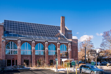 Historic brick church retrofitted with rooftop solar panels in Toronto&rsquo;s Beaches neighbourhood during winter, showing renewable energy integration, sustainable building technology, and urban clean pow