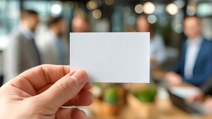 Blank card hand business opportunity teamwork office blurred group people meeting professional creative workspace communication concept planning collaboration modern casual brainstorming success