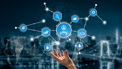 A hand reaches toward an array of business icons representing customer relationship management, illustrating connections and interaction within a digital network. Tessel