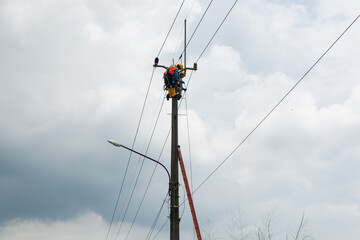 Technicians working on electricity towers