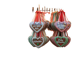 Colorful German gingerbread hearts with festive ribbons and German phrases
