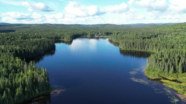 Serene forest lake view in Quebec's Seigneurie du Triton area