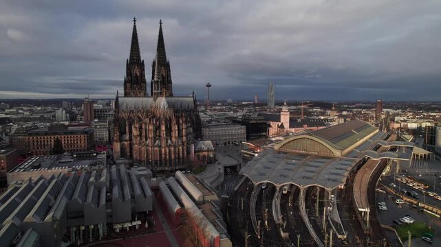 K&ouml;ln or Cologne Germany, beautiful aerial cityscape with Kolner Dom Cathedral and HBF train station, cinematic 4K drone shot.