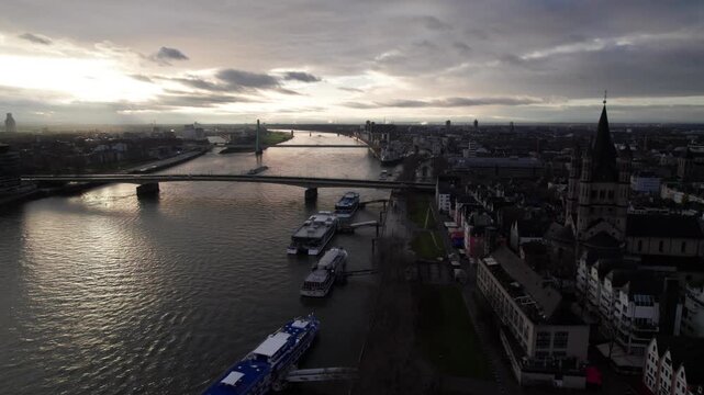 Dark moody aerial of the Rhine River in Cologne, Germany, 4K