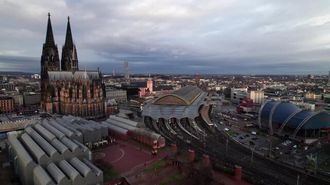 Cologne, Germany aerial establishing shot with Kolner Dom and HBF train station, 4K drone shot