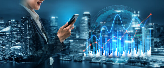 A professional businesswoman analyzes financial data on her smartphone against a modern city...