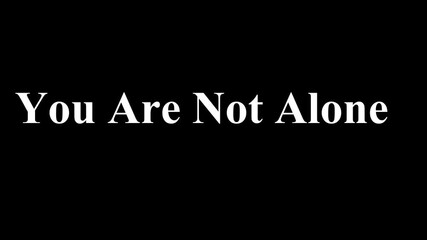 Powerful black and white text graphic displays the supportive message you are not alone