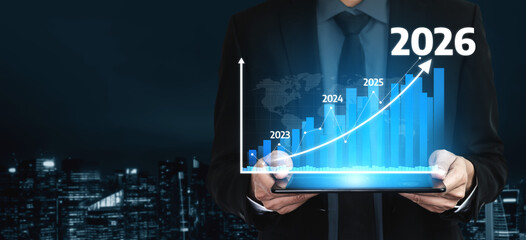 A businessman stands confidently while holding a tablet displaying a bright digital graph that projects substantial growth from 2023 to 2026 against a city backdrop. Tessel
