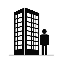 Man standing next to a tall building