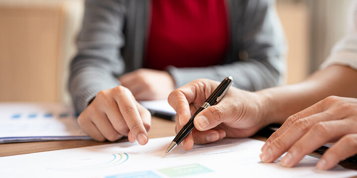 Two Asian businessman talk, consult, discuss working with new startup project idea presentation analyze plan marketing and investment in the office. - Powered by Adobe