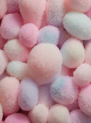 Soft pastel pom-poms in pink, blue, and white create dreamy textured background &mdash; perfect for baby, craft, or sweet-themed designs