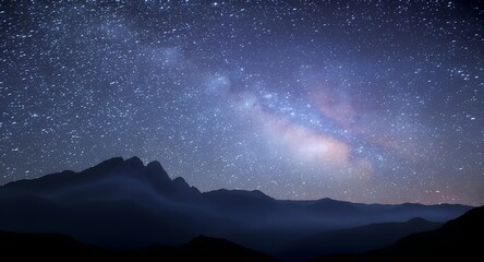 Breathtaking starry night sky over majestic mountain range