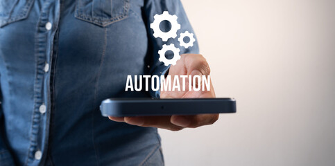 System automation, a woman holds a smartphone with gear icons and the word "Automation"