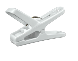 A close-up image of a white plastic clothespin, open, resting on a black background, showing its internal spring