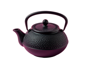 A close-up shot of a dark, ornate kettle against a black background. The cast iron object has a circular form with an arched handle