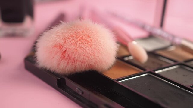 Makeup tools and colors on a table for application