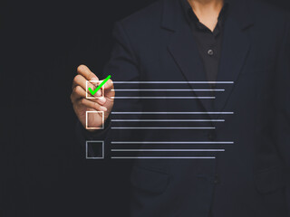 Businessman checking checklist for approval and quality control.