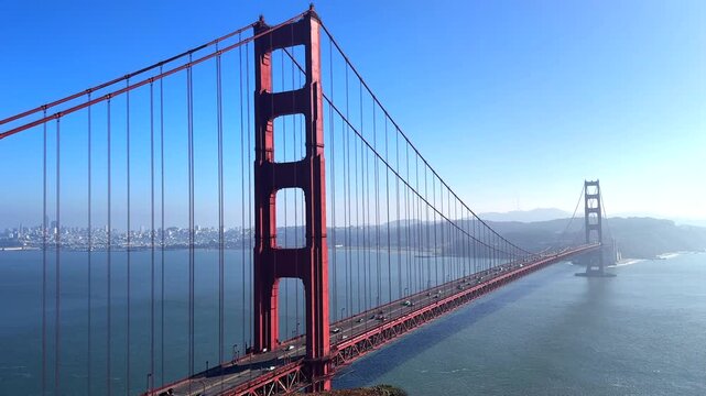 Aerial view of Golden Gate Bridge in San Francisco with blue sky calm bay and cityscape 