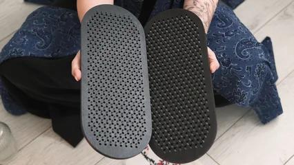 Fotobehang Lotusbloem Sadhu board. Yoga tool. Woman sitting in lotus position hand holding sharp nails for practice meditation foot massage spiritual growth.  © golubovy