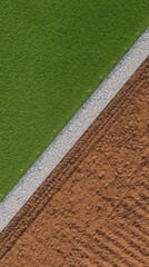 Grass field border with tire tracks