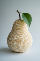 Textured pear with a single green leaf and stem, isolated on a light grey background