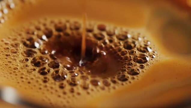 Macro Shot of Coffee Bubbles - A Close-Up View.