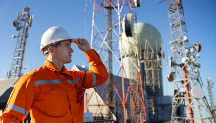 Engineer inspecting communication towers for 5G and 6G network deployment