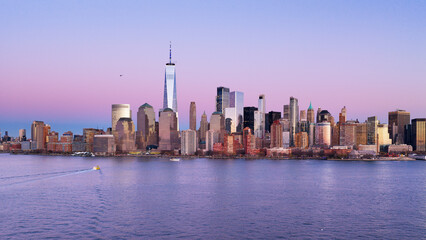 Obraz premium New York skyline with Manhattan Tower. NYC panoramic view of Lower Manhattan skyline. New York City, Manhattan skyline. NYC night cityscape with Manhattan. New York City panoramic skyline.
